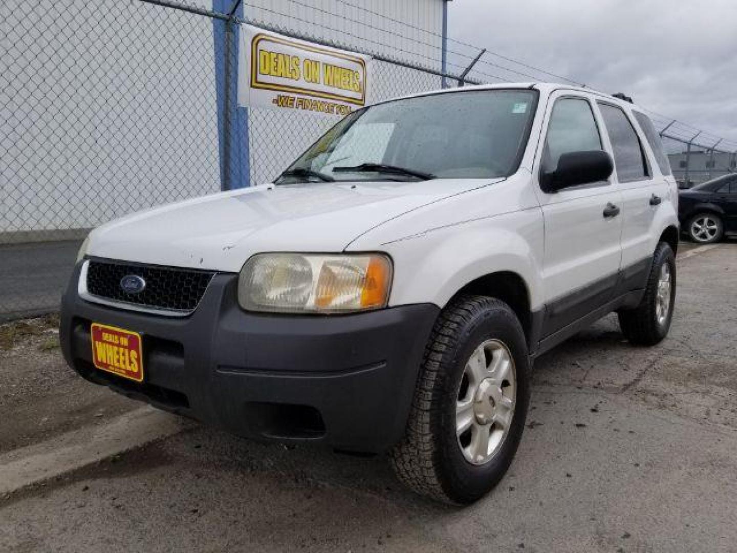 2004 Oxford White Ford Escape XLT 4WD (1FMYU93114D) with an 3.0L V6 DOHC 24V engine, 4-Speed Automatic transmission, located at 1821 N Montana Ave., Helena, MT, 59601, (406) 422-1031, 0.000000, 0.000000 - Photo#0