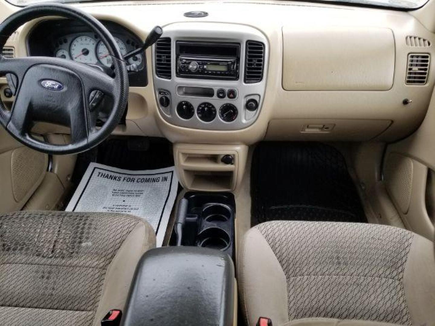 2004 Oxford White Ford Escape XLT 4WD (1FMYU93114D) with an 3.0L V6 DOHC 24V engine, 4-Speed Automatic transmission, located at 1821 N Montana Ave., Helena, MT, 59601, (406) 422-1031, 0.000000, 0.000000 - Photo#11