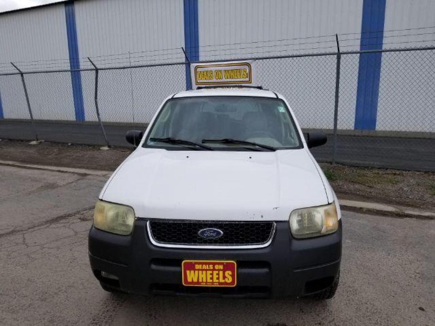 2004 Oxford White Ford Escape XLT 4WD (1FMYU93114D) with an 3.0L V6 DOHC 24V engine, 4-Speed Automatic transmission, located at 1821 N Montana Ave., Helena, MT, 59601, (406) 422-1031, 0.000000, 0.000000 - Photo#1