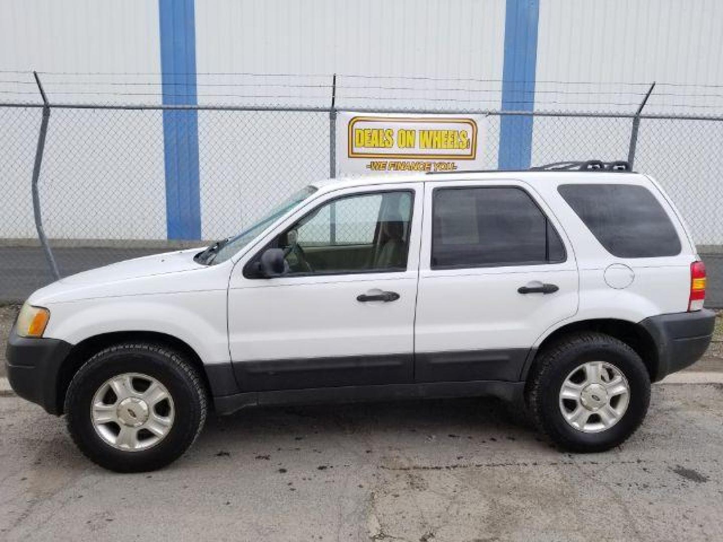 2004 Oxford White Ford Escape XLT 4WD (1FMYU93114D) with an 3.0L V6 DOHC 24V engine, 4-Speed Automatic transmission, located at 1821 N Montana Ave., Helena, MT, 59601, (406) 422-1031, 0.000000, 0.000000 - Photo#2