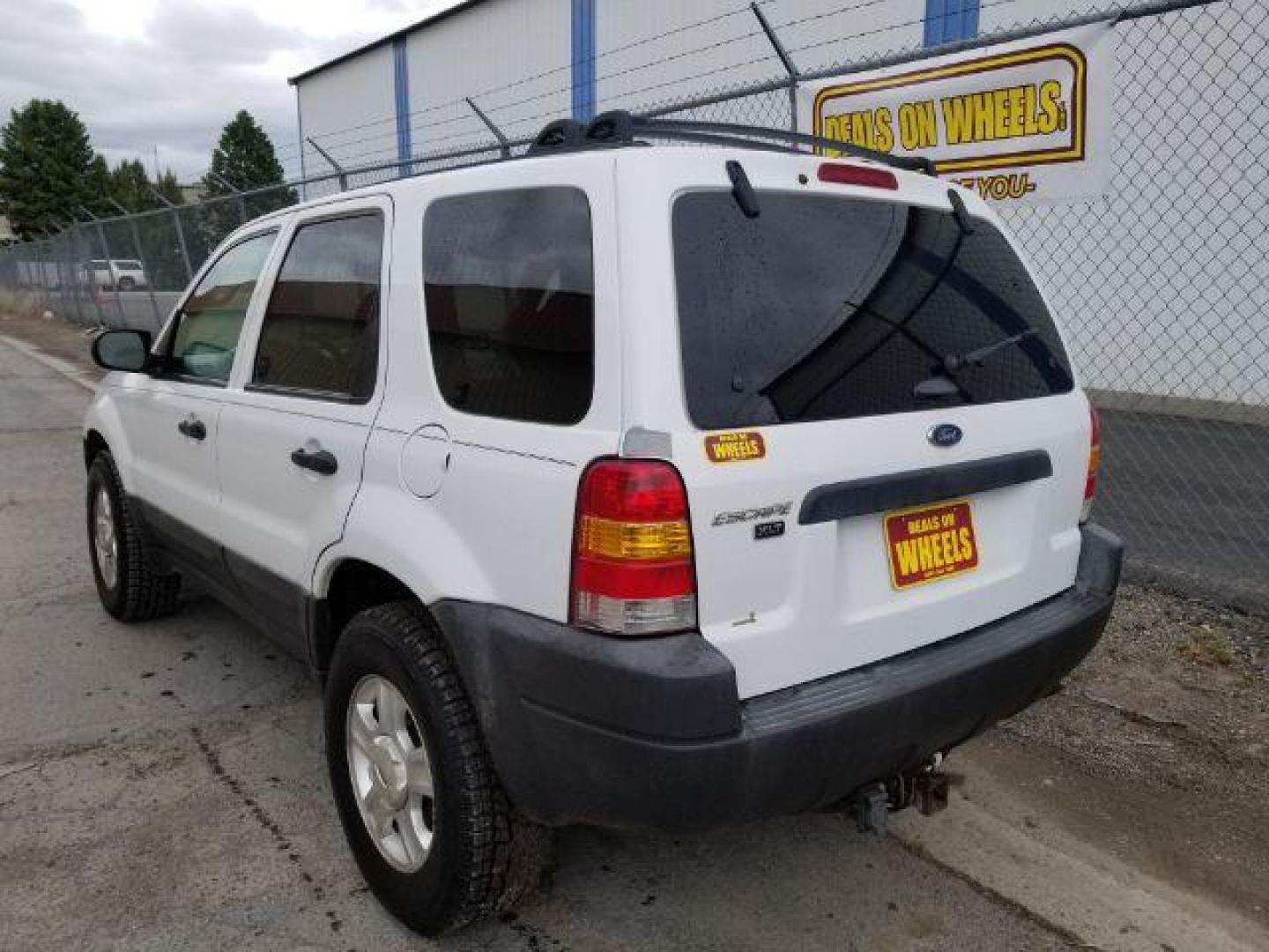 2004 Oxford White Ford Escape XLT 4WD (1FMYU93114D) with an 3.0L V6 DOHC 24V engine, 4-Speed Automatic transmission, located at 1821 N Montana Ave., Helena, MT, 59601, (406) 422-1031, 0.000000, 0.000000 - Photo#3