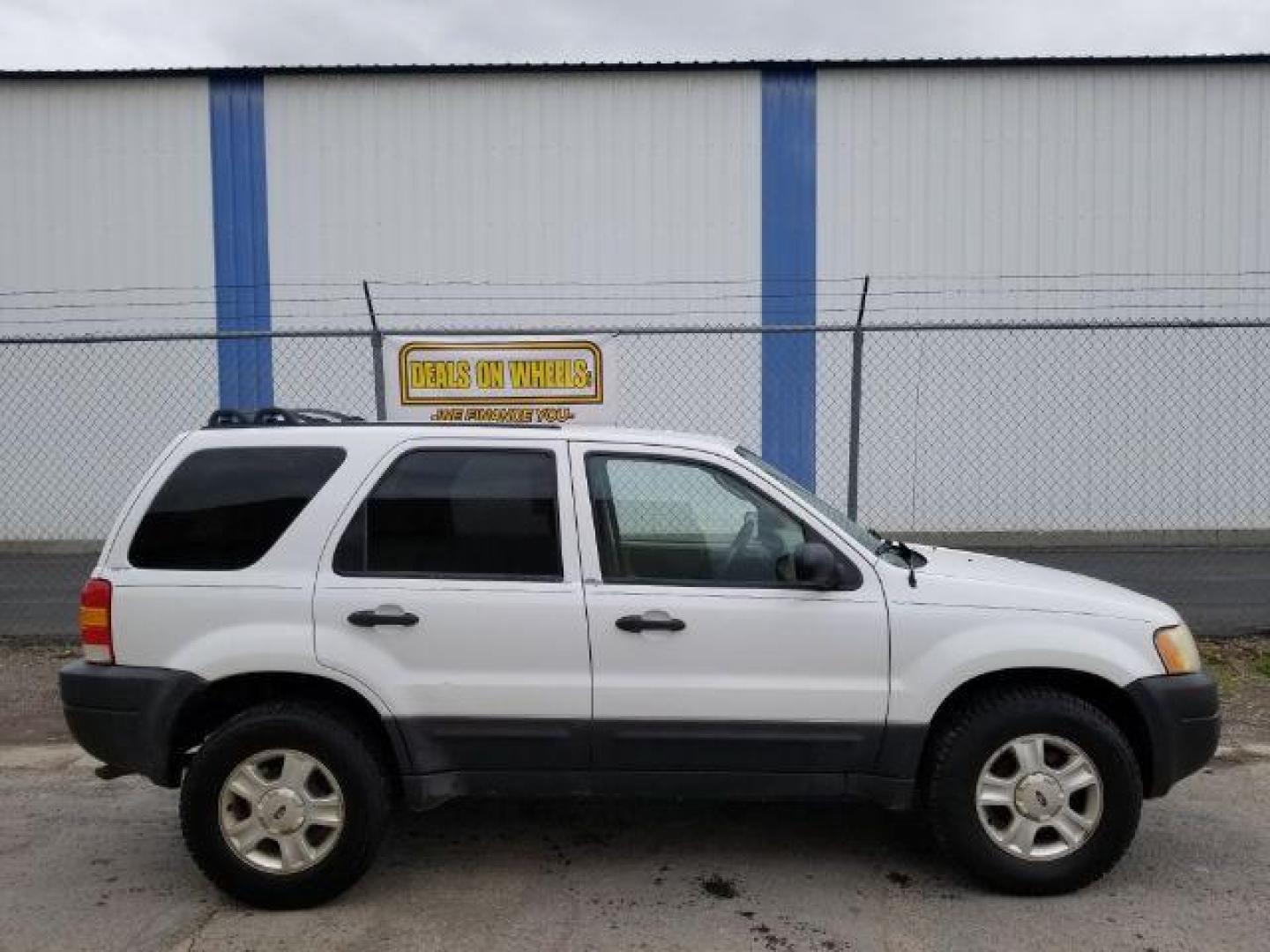 2004 Oxford White Ford Escape XLT 4WD (1FMYU93114D) with an 3.0L V6 DOHC 24V engine, 4-Speed Automatic transmission, located at 1821 N Montana Ave., Helena, MT, 59601, (406) 422-1031, 0.000000, 0.000000 - Photo#5