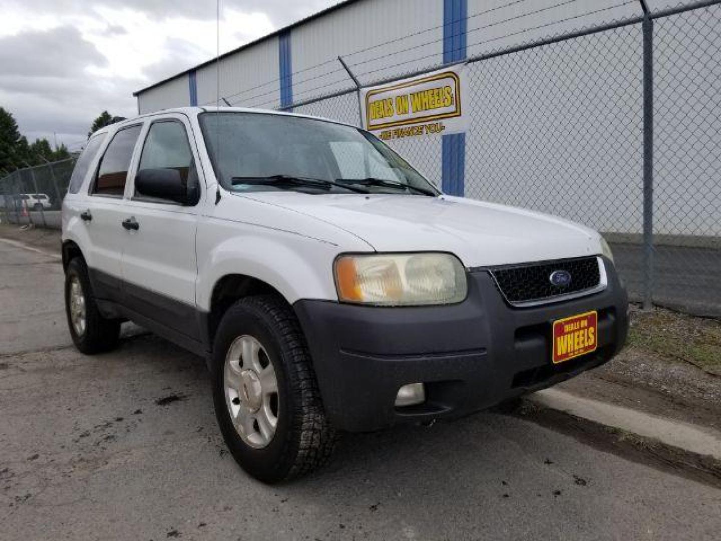 2004 Oxford White Ford Escape XLT 4WD (1FMYU93114D) with an 3.0L V6 DOHC 24V engine, 4-Speed Automatic transmission, located at 1821 N Montana Ave., Helena, MT, 59601, (406) 422-1031, 0.000000, 0.000000 - Photo#6