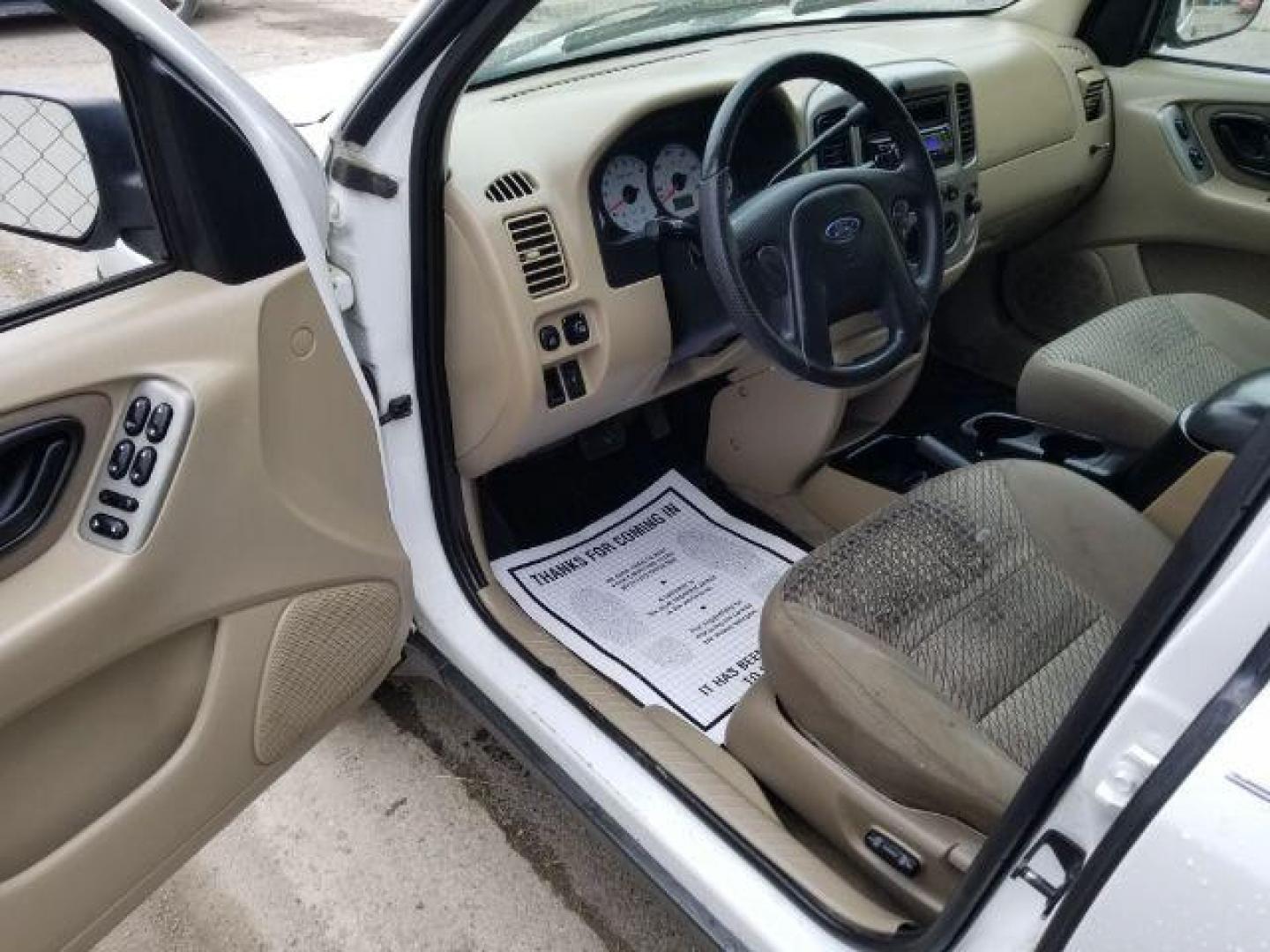 2004 Oxford White Ford Escape XLT 4WD (1FMYU93114D) with an 3.0L V6 DOHC 24V engine, 4-Speed Automatic transmission, located at 1821 N Montana Ave., Helena, MT, 59601, (406) 422-1031, 0.000000, 0.000000 - Photo#7