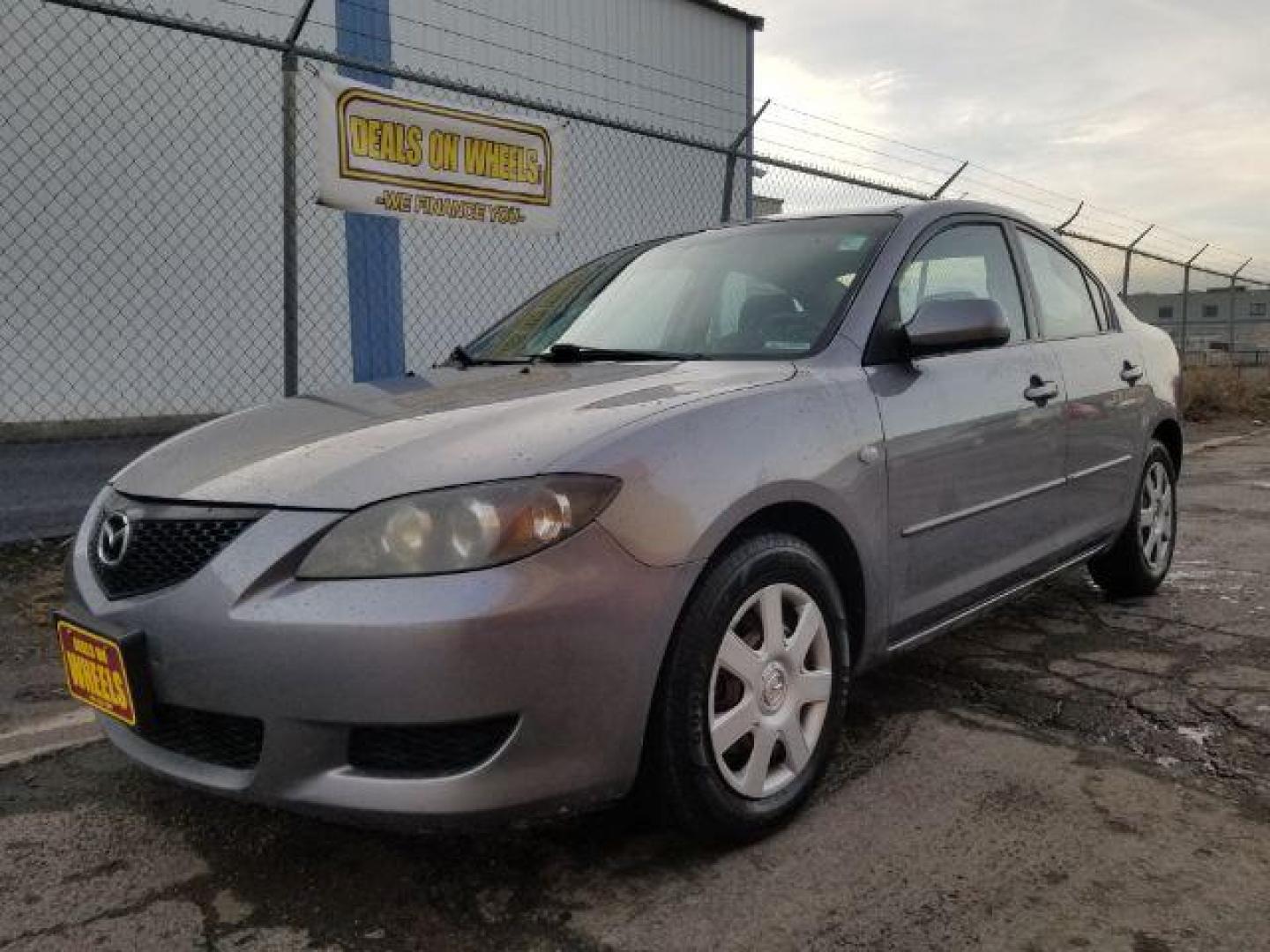 2006 Mazda MAZDA3 i 4-door (JM1BK12FX61) with an 2.0L L4 DOHC 16V engine, located at 4047 Montana Ave., Billings, MT, 59101, 45.770847, -108.529800 - Photo#0