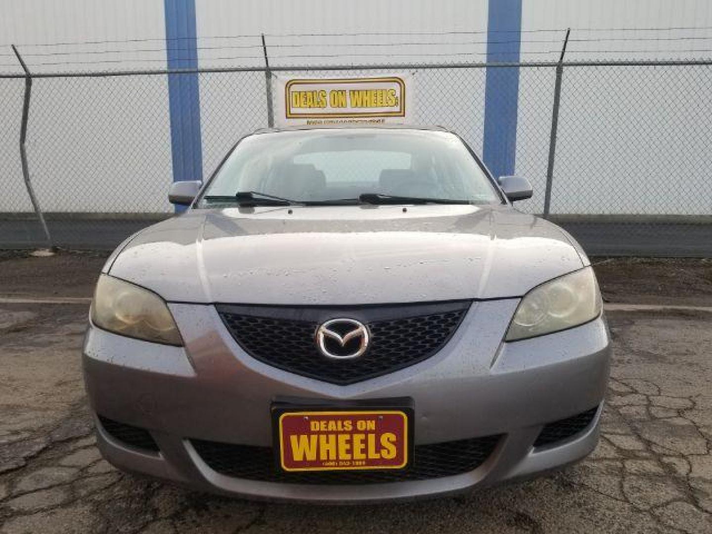 2006 Mazda MAZDA3 i 4-door (JM1BK12FX61) with an 2.0L L4 DOHC 16V engine, located at 4047 Montana Ave., Billings, MT, 59101, 45.770847, -108.529800 - Photo#1