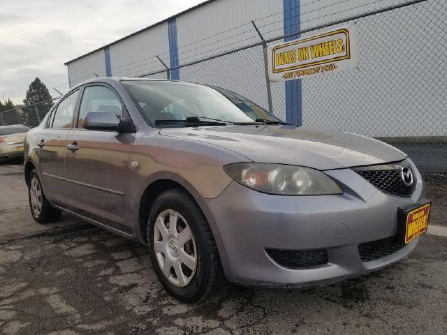 2006 Mazda MAZDA3 i 4-door (JM1BK12FX61) with an 2.0L L4 DOHC 16V engine, located at 4047 Montana Ave., Billings, MT, 59101, 45.770847, -108.529800 - Photo#2