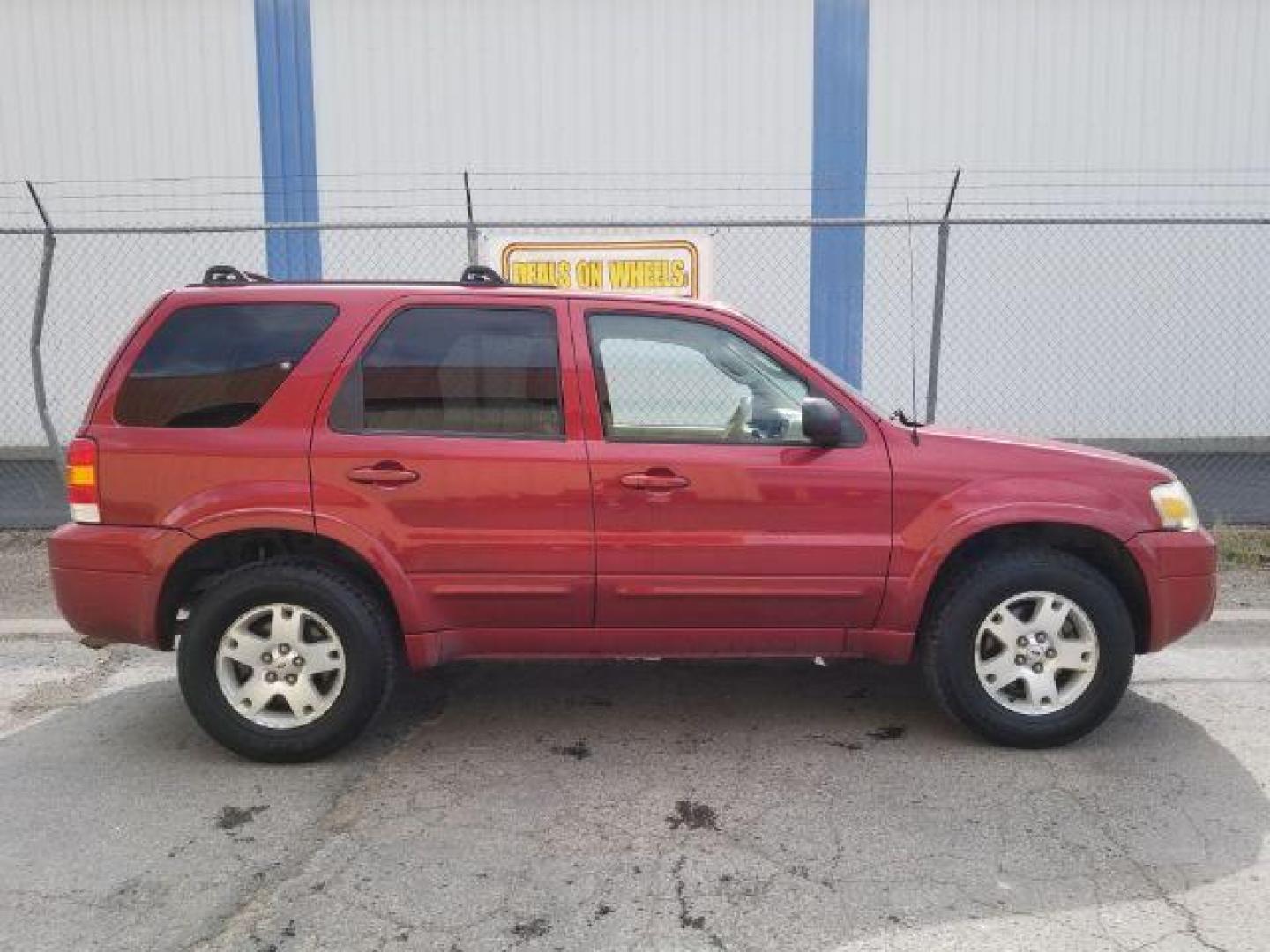 2007 Red Fire Metallic Ford Escape Limited 4WD (1FMYU94127K) with an 3.0L V6 DOHC 24V engine, 4-Speed Automatic transmission, located at 4801 10th Ave S,, Great Falls, MT, 59405, 0.000000, 0.000000 - Photo#5