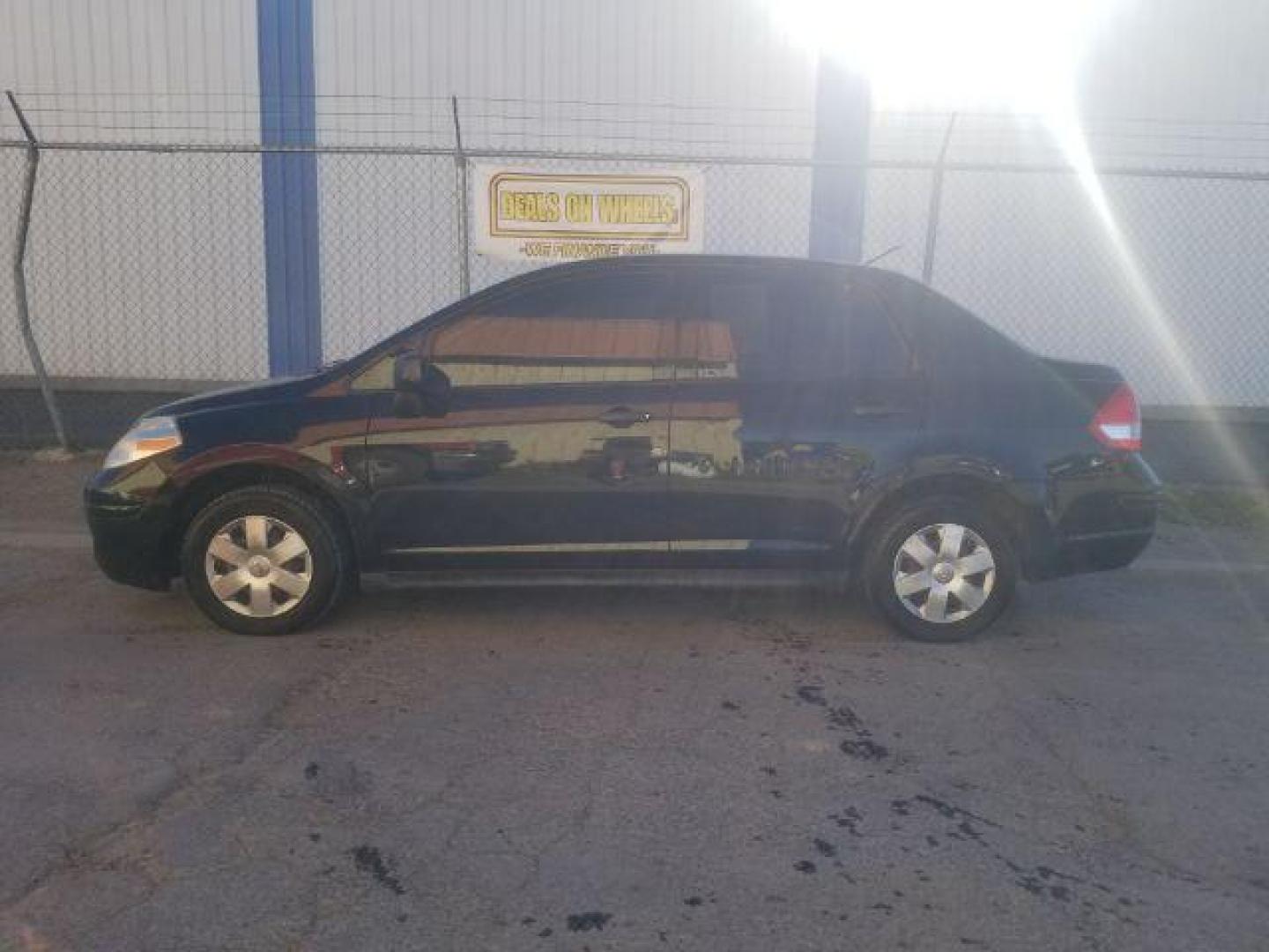 2009 Nissan Versa 1.6 Base Sedan (3N1CC11E79L) with an 1.6L L4 DOHC 16V engine, 5-Speed Manual transmission, located at 601 E. Idaho St., Kalispell, MT, 59901, 0.000000, 0.000000 - Photo#2