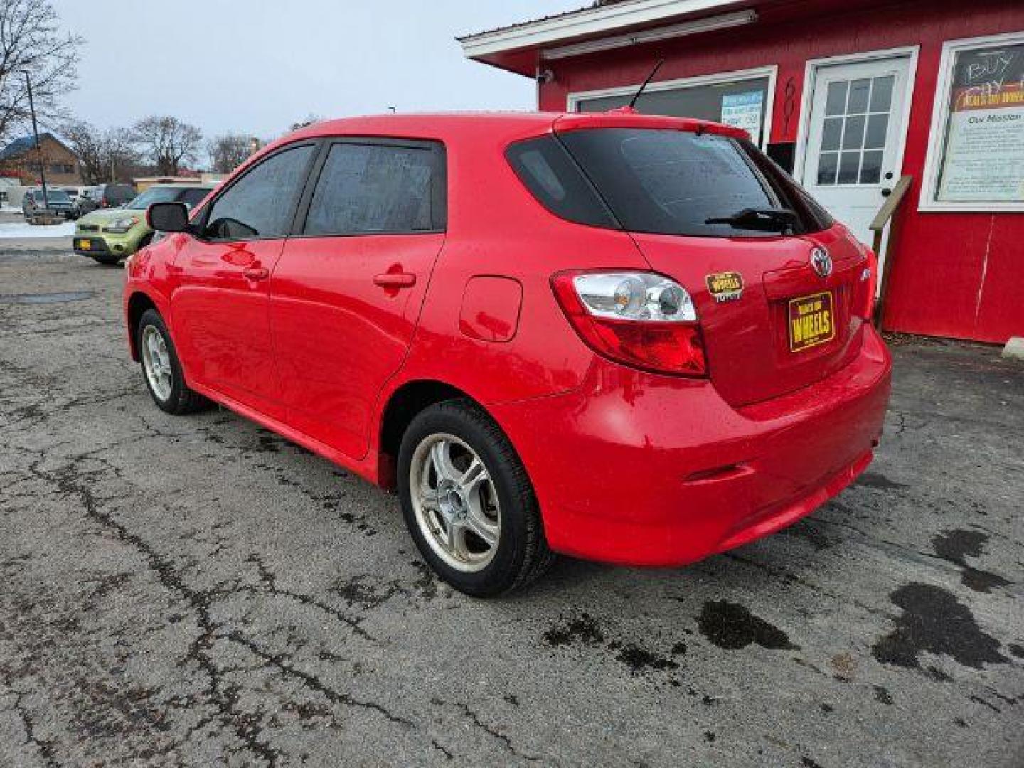 2009 Radiant Red Toyota Matrix Base 5-Speed MT (2T1KU40E09C) with an 1.8L L4 DOHC 16V engine, 5-Speed Manual transmission, located at 601 E. Idaho St., Kalispell, MT, 59901, 0.000000, 0.000000 - Photo#2