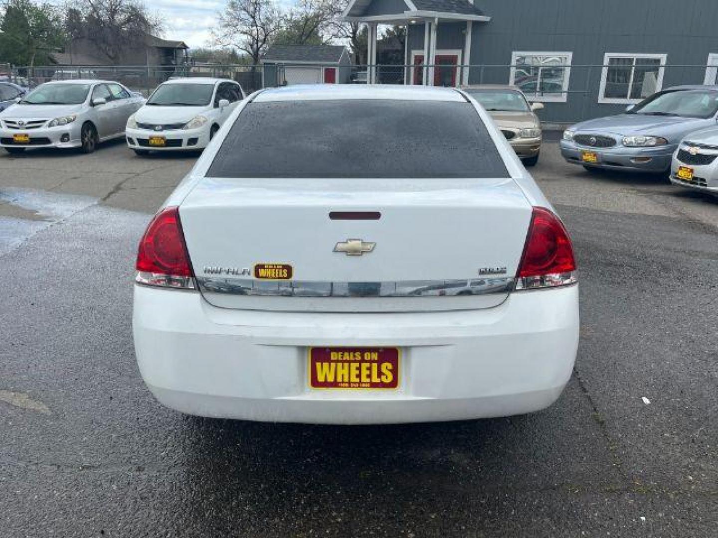 2011 Summit White Chevrolet Impala LS (2G1WF5EK9B1) with an 3.5L V6 OHV 16V FFV engine, 4-Speed Automatic transmission, located at 1821 N Montana Ave., Helena, MT, 59601, (406) 422-1031, 0.000000, 0.000000 - Photo#4