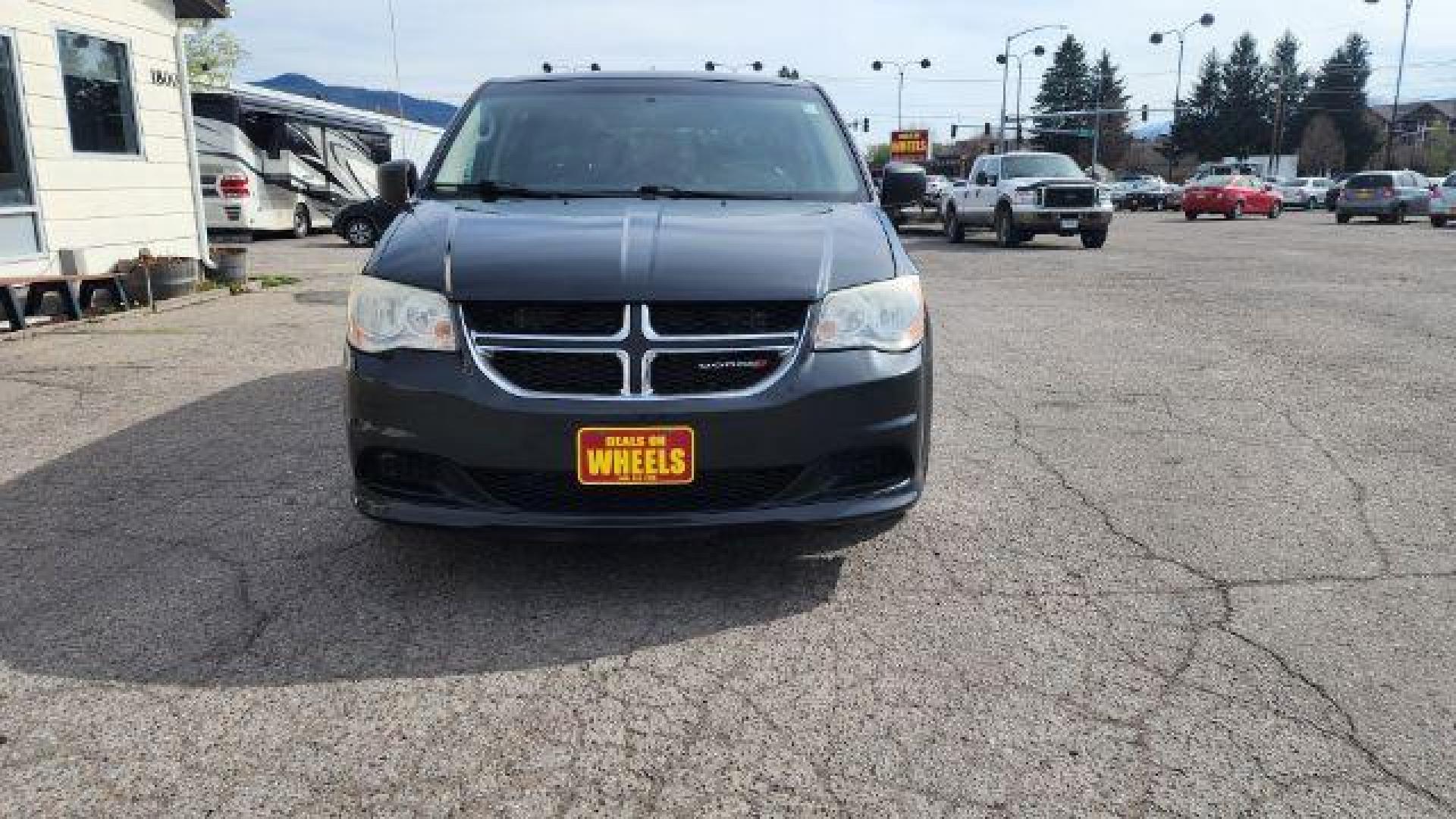 2012 Dark Charcoal Pearl Dodge Grand Caravan SE (2C4RDGBG9CR) with an 3.6L V6 DOHC 24V engine, 6-Speed Automatic transmission, located at 1800 West Broadway, Missoula, 59808, (406) 543-1986, 46.881348, -114.023628 - Photo#1