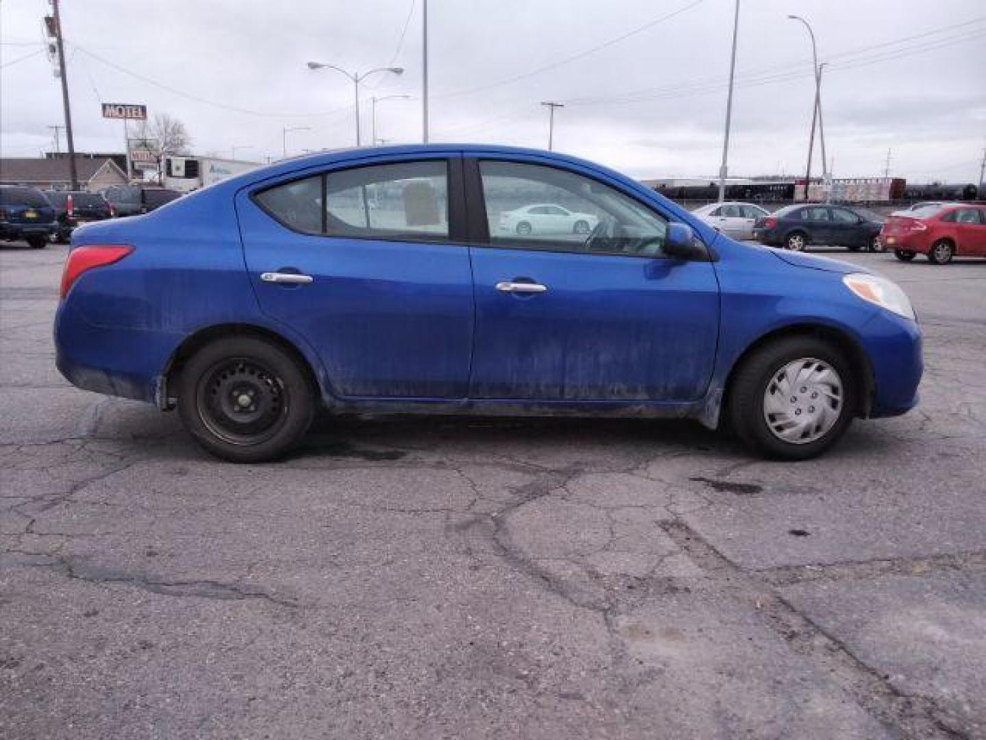 2012 Nissan Versa 1.6 SV Sedan (3N1CN7AP3CL) with an 1.6L L4 DOHC 16V engine, located at 4047 Montana Ave., Billings, MT, 59101, 45.770847, -108.529800 - Photo#4