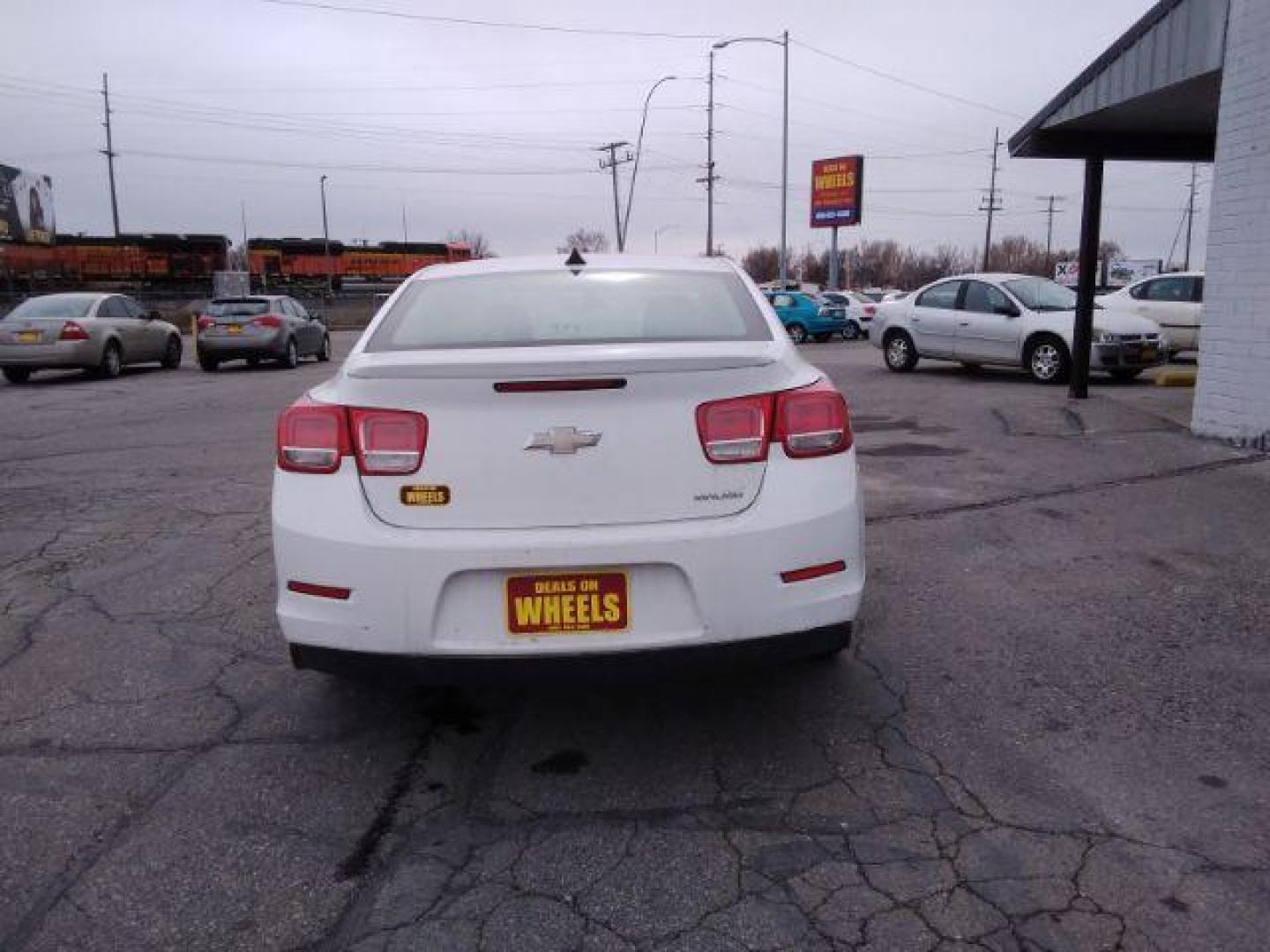 2013 Summit White Chevrolet Malibu LS (1G11B5SAXDF) with an 2.5L L4 DOHC 16V engine, 6-Speed Automatic transmission, located at 4047 Montana Ave., Billings, MT, 59101, 45.770847, -108.529800 - Photo#5