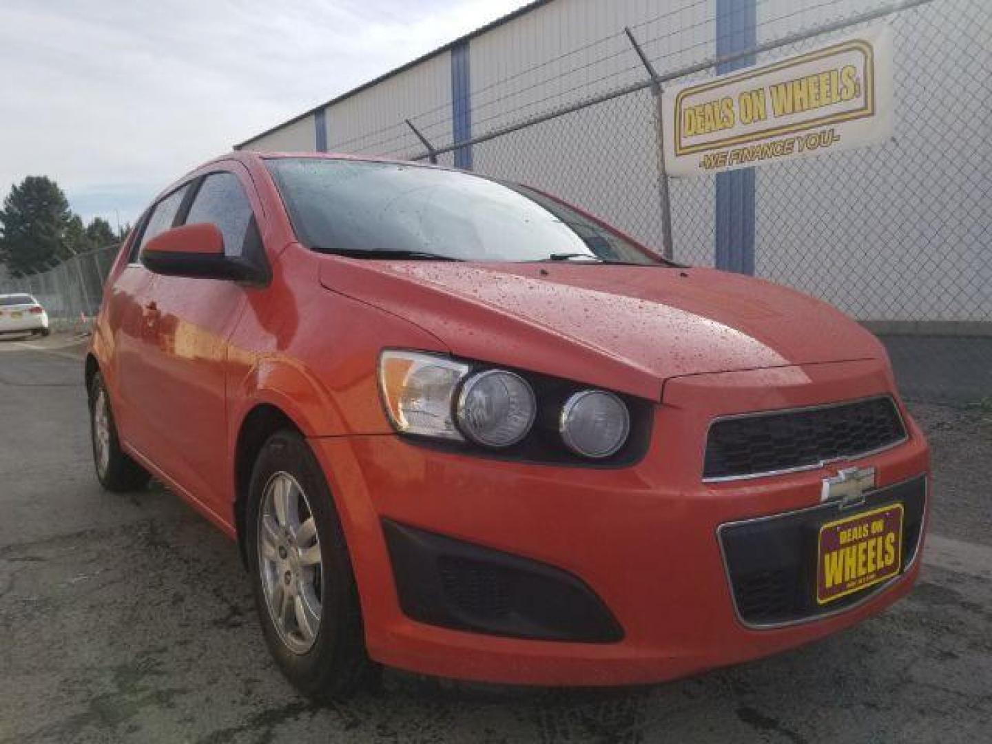 2013 Chevrolet Sonic LT Auto 5-Door (1G1JC6SG0D4) with an 1.8L L4 DOHC 24V engine, 6-Speed Automatic transmission, located at 4047 Montana Ave., Billings, MT, 59101, 45.770847, -108.529800 - Photo#2