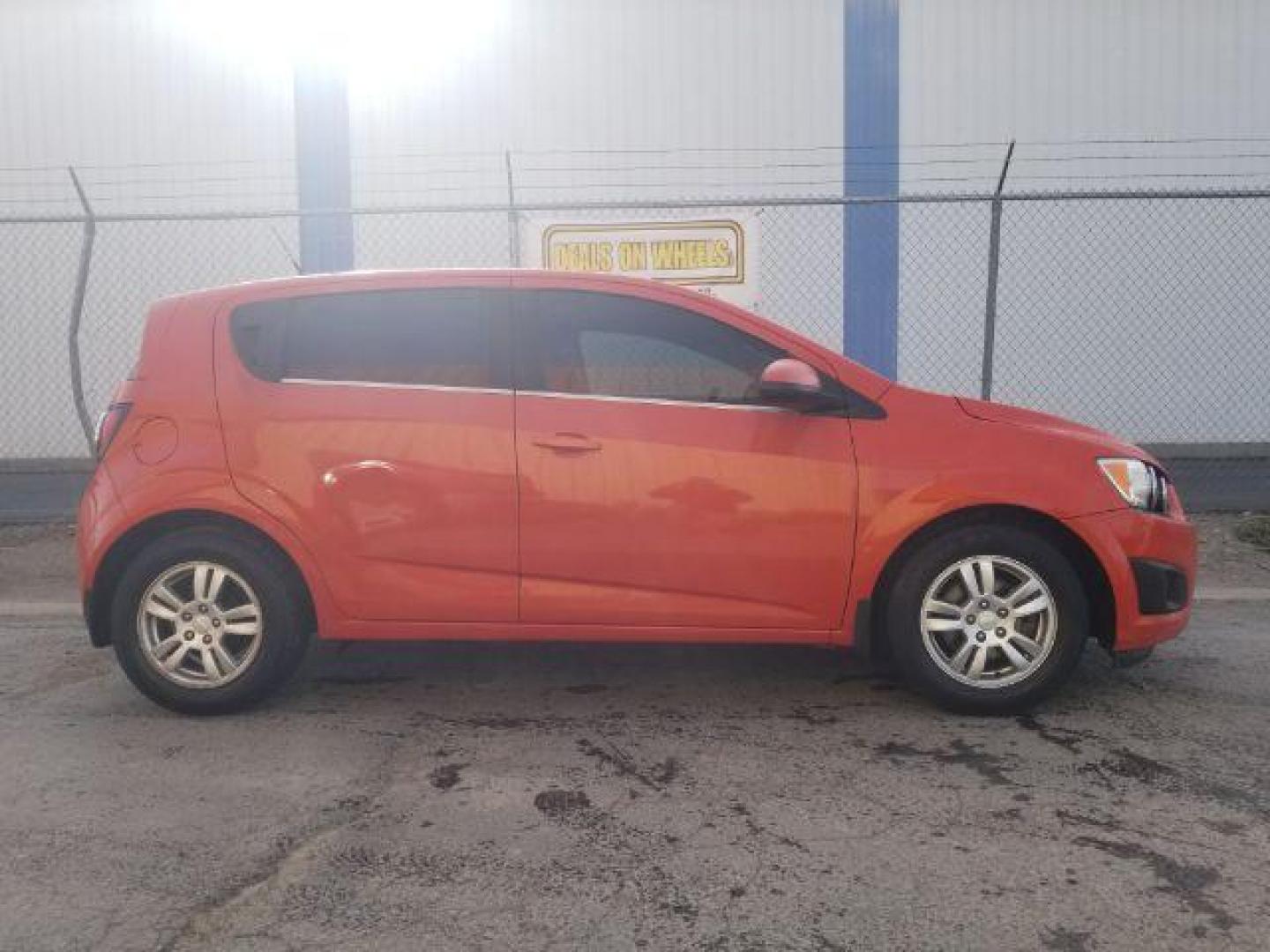 2013 Chevrolet Sonic LT Auto 5-Door (1G1JC6SG0D4) with an 1.8L L4 DOHC 24V engine, 6-Speed Automatic transmission, located at 4047 Montana Ave., Billings, MT, 59101, 45.770847, -108.529800 - Photo#3