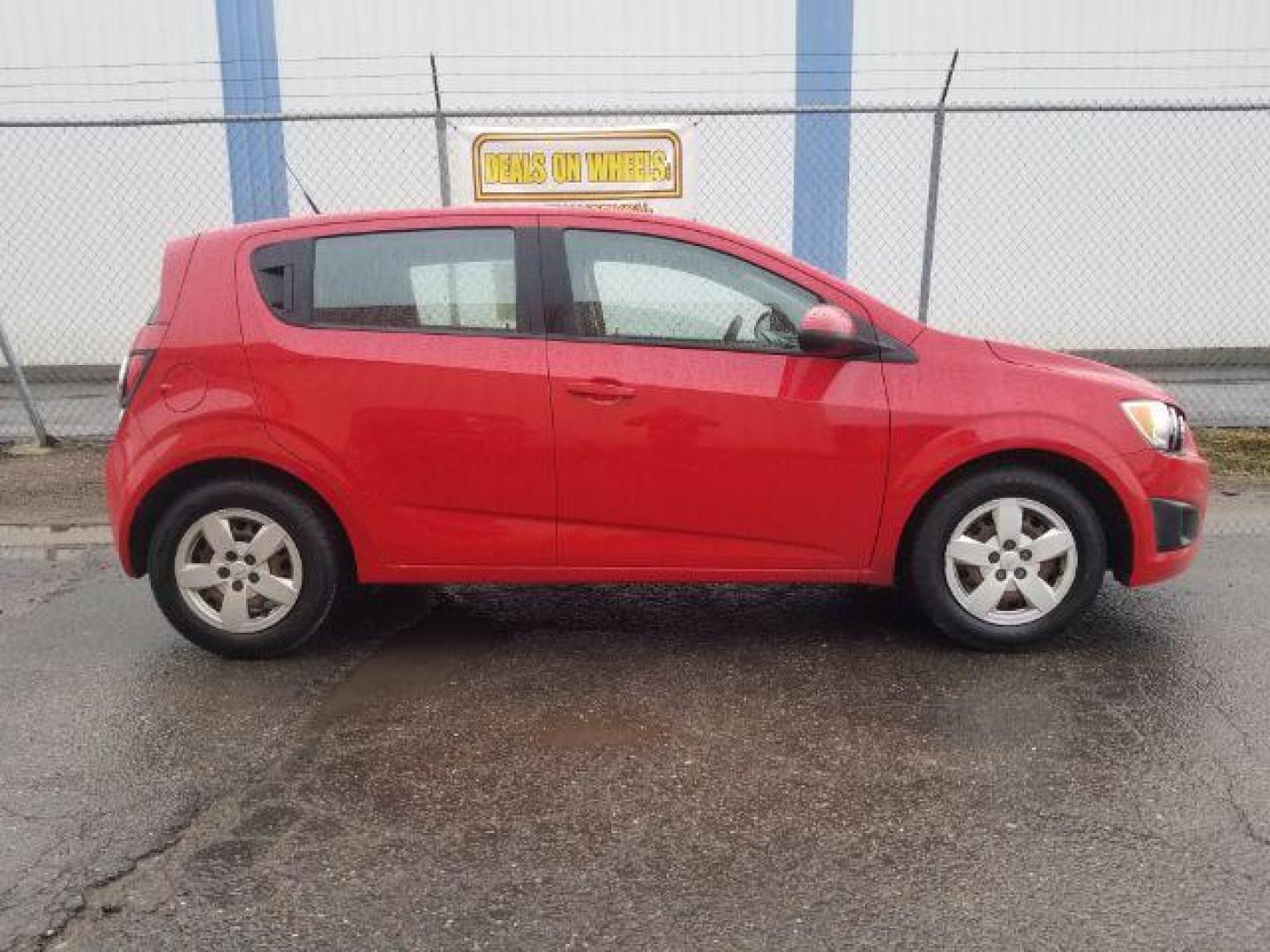 2013 Chevrolet Sonic LS Auto 5-Door (1G1JA6SH6D4) with an 1.8L L4 DOHC 24V engine, 6-Speed Automatic transmission, located at 4047 Montana Ave., Billings, MT, 59101, 45.770847, -108.529800 - Photo#3