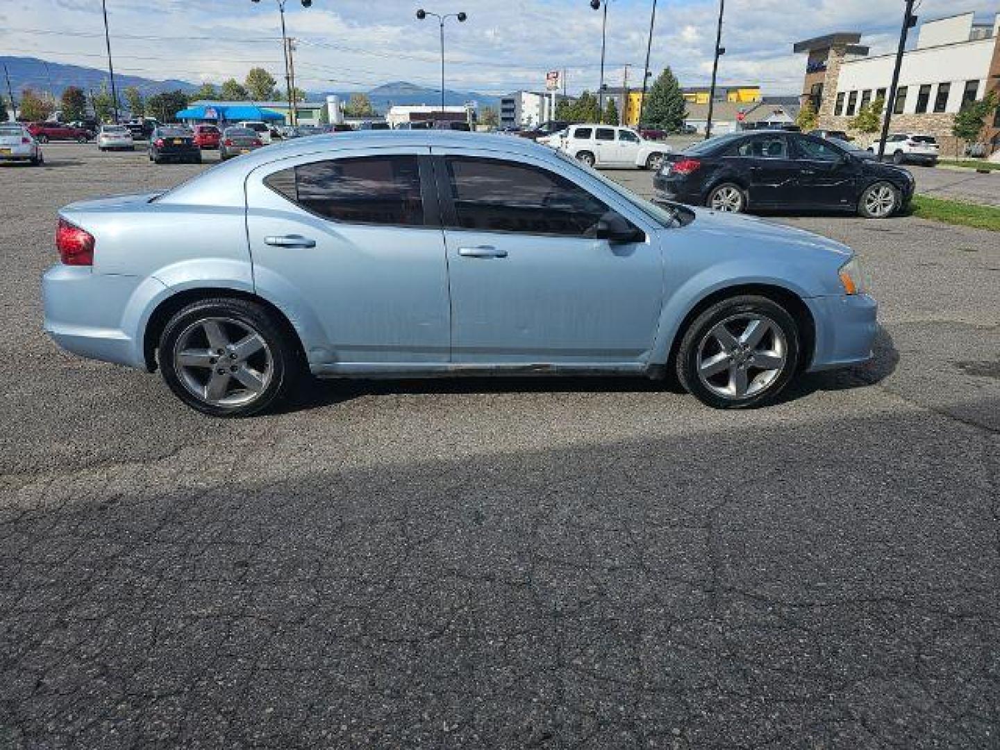 2013 Dodge Avenger Base (1C3CDZAB0DN) with an 2.4L L4 DOHC 16V engine, 4-Speed Automatic transmission, located at 4047 Montana Ave., Billings, MT, 59101, 45.770847, -108.529800 - Photo#2