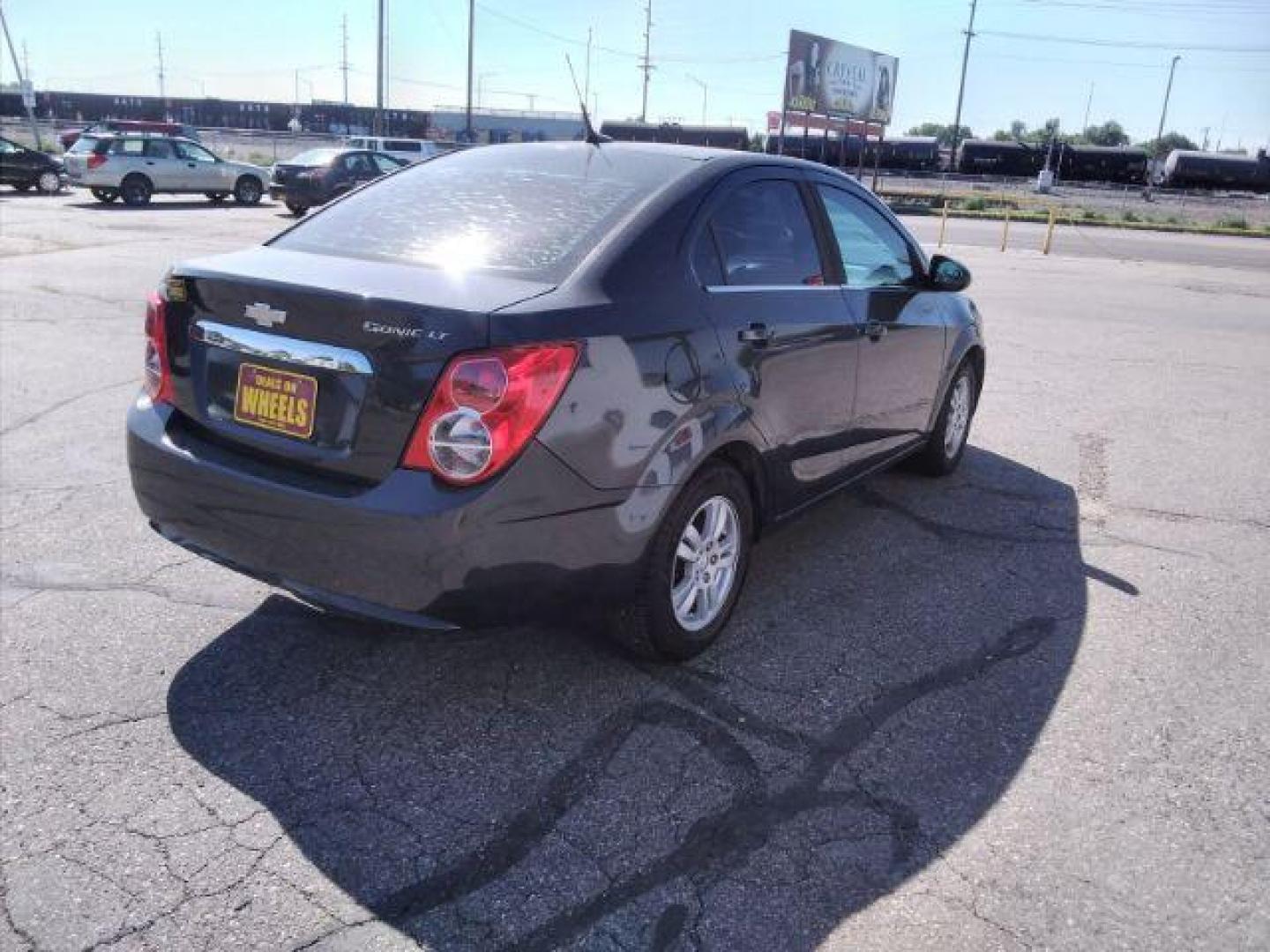 2014 Chevrolet Sonic LT Auto Sedan (1G1JC5SH9E4) with an 1.8L L4 DOHC 24V engine, 6-Speed Automatic transmission, located at 4047 Montana Ave., Billings, MT, 59101, 45.770847, -108.529800 - Photo#6