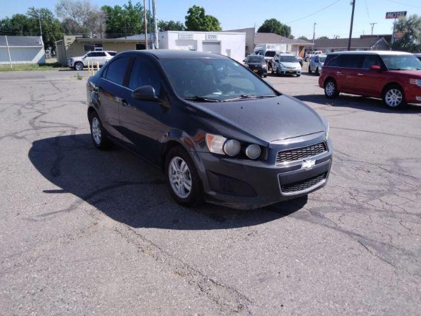 2014 Chevrolet Sonic LT Auto Sedan (1G1JC5SH9E4) with an 1.8L L4 DOHC 24V engine, 6-Speed Automatic transmission, located at 4047 Montana Ave., Billings, MT, 59101, 45.770847, -108.529800 - Photo#4