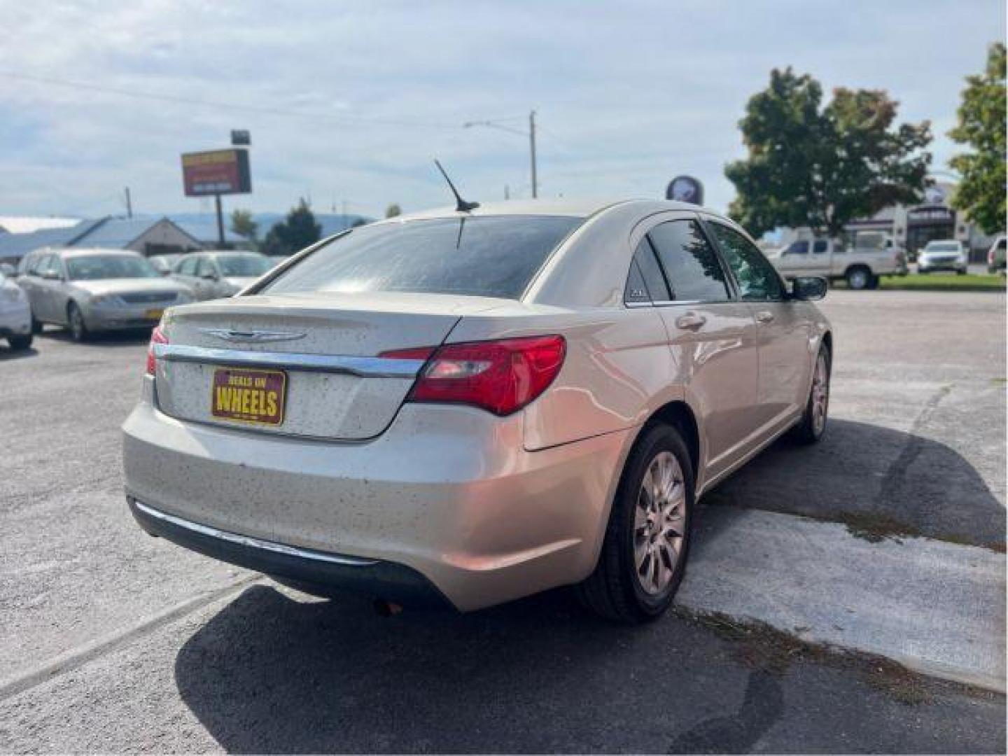 2014 Chrysler 200 LX (1C3CCBAB4EN) with an 2.4L L4 DOHC 16V engine, 6-Speed Automatic transmission, located at 601 E. Idaho St., Kalispell, MT, 59901, 0.000000, 0.000000 - Photo#4