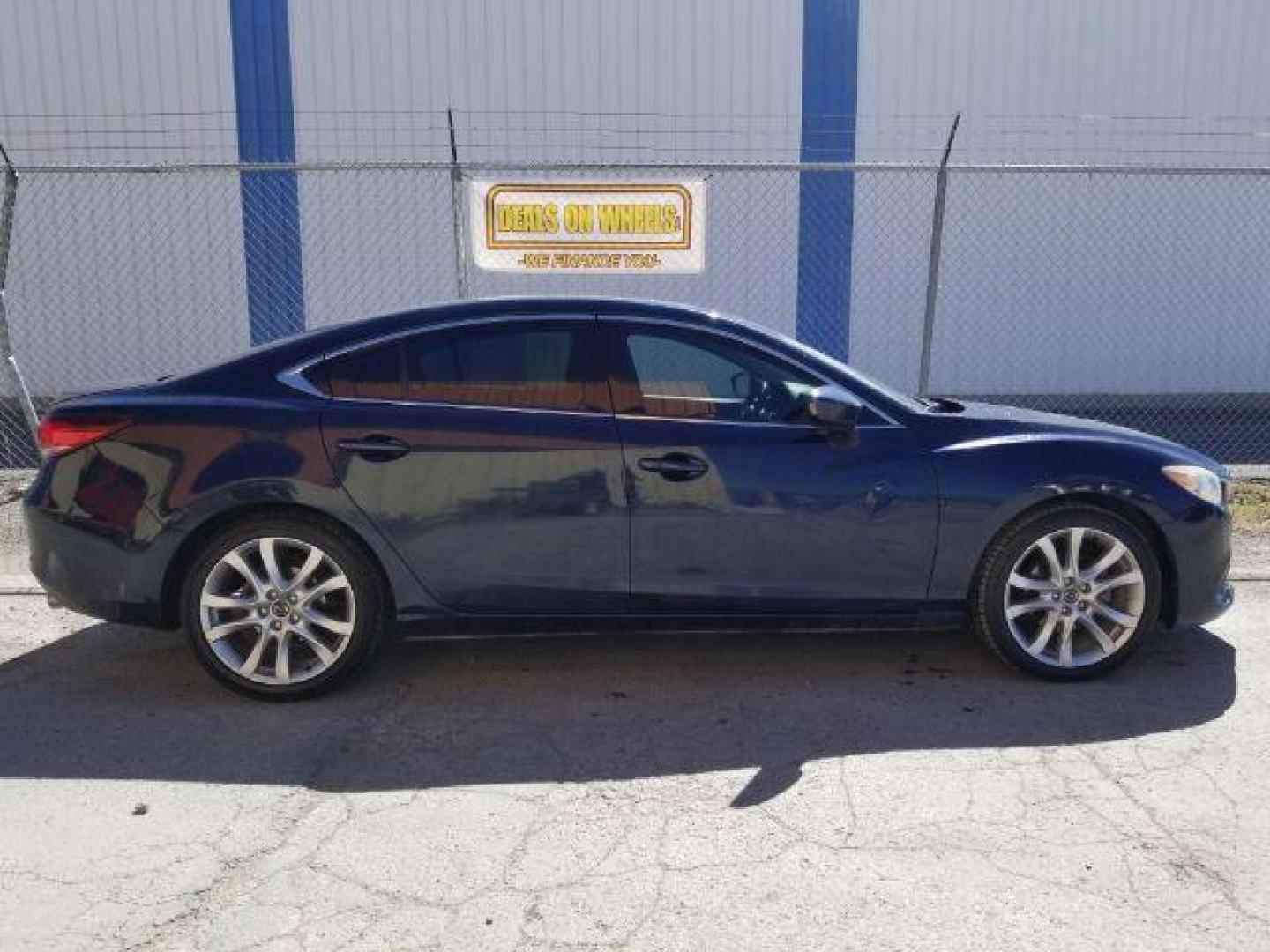 2015 Deep Crystal Blue Mazda Mazda6 i Touring (JM1GJ1V56F1) with an 2.5L L4 DOHC 16V engine, 6-Speed Automatic transmission, located at 4047 Montana Ave., Billings, MT, 59101, 45.770847, -108.529800 - Photo#5